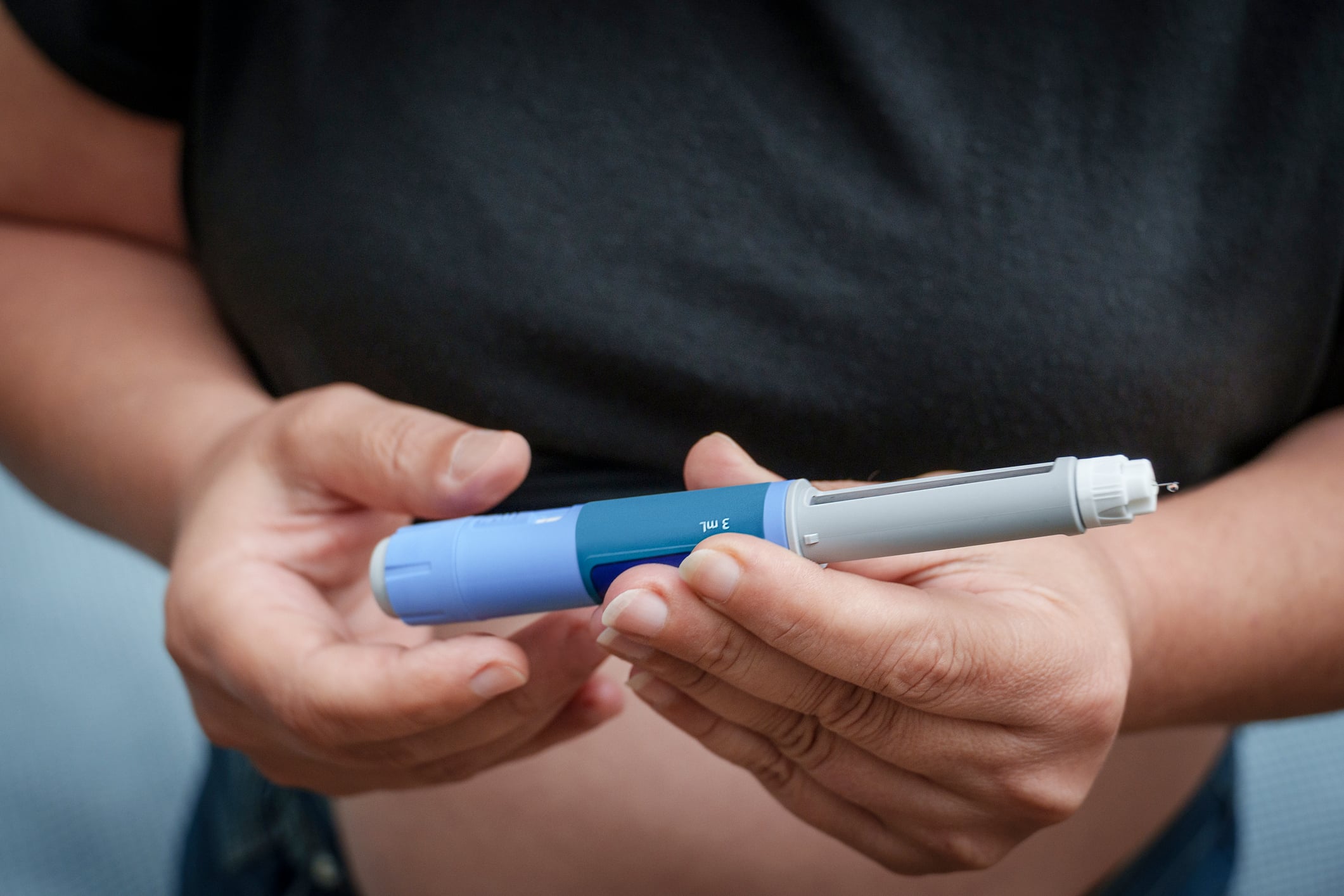 person holding a glp-1 medication