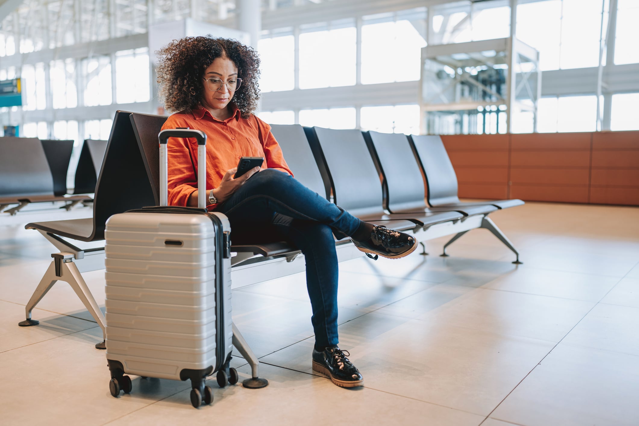 Women at airport with her luggage