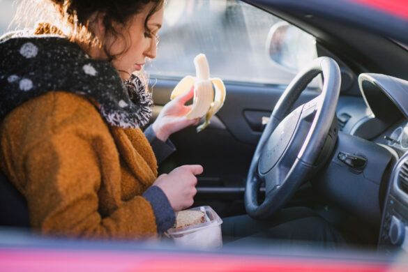 Woman eating in her car