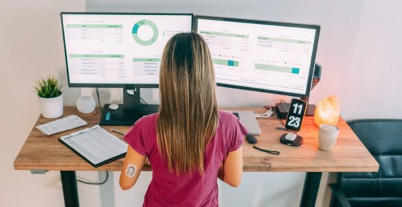 Woman checking CGM metrics on computer