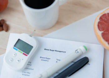 Image of coffee, fruit, and diabetes management tools