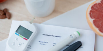 Image of coffee, fruit, and diabetes management tools