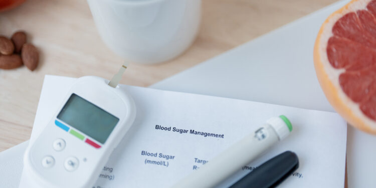 Image of coffee, fruit, and diabetes management tools