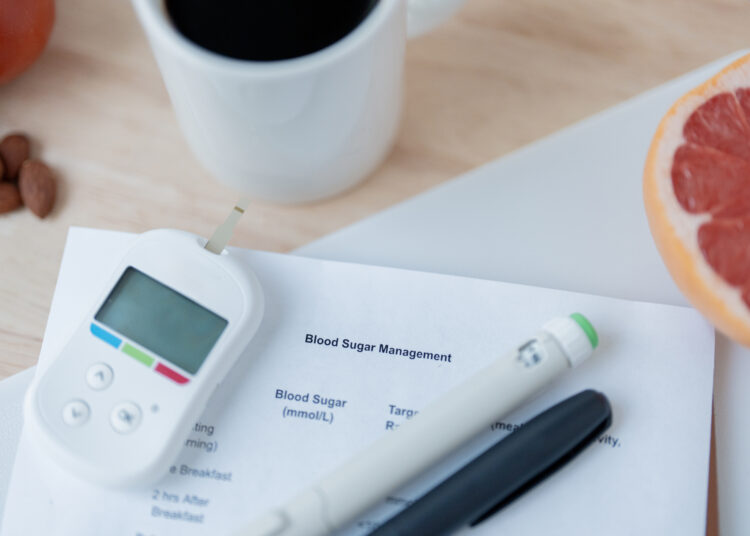 Image of coffee, fruit, and diabetes management tools